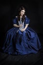 Renaissance woman in blue silk dress