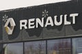 Renault brand logo on the car dealership wall, in winter.