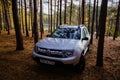 Renault Duster car in pine forest at Tula Region, Russia - October 07, 2020