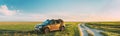 Renault Duster SUV In Spring Field Countryside Landscape. Duster Produced Jointly By French Manufacturer Renault And Its