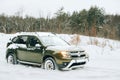 Renault Duster Suv In Winter Coniferous Forest. Compact Crossover Developed At Renault Technocenter In Guyancourt