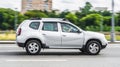 Renault Duster 4x4 AT SUV car on the city road. Silver color compact SUV driving on Moscow street Royalty Free Stock Photo