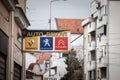 Renault Peugeot and Citroen logos on an sign of a car mechanic in Belgrade.