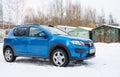 Renault Sandero Stepway parked in winter street. Royalty Free Stock Photo