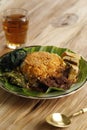 Rendang Nasi Padang, Famous Traditional Food from Indonesia. Rice Served with Beef Rendang, Curry, Boiled Cassava Leaves Royalty Free Stock Photo