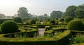 A stunning view of a geometric formal garden with manicured topiary spheres Royalty Free Stock Photo