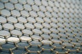 Rendering gold nanotechnology hexagonal geometric form close-up, concept graphene atomic structure, molecular