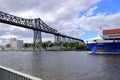 Rendsburg, Germany - August 22 2025: cargo ship pass beneath the Rendsburg High Bridge on the Kiel Canal Royalty Free Stock Photo