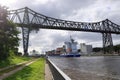Rendsburg, Germany - August 22 2025: cargo ship pass beneath the Rendsburg High Bridge on the Kiel Canal Royalty Free Stock Photo