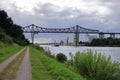 Rendsburg, Germany - August 22 2025: cargo ship pass beneath the Rendsburg High Bridge on the Kiel Canal Royalty Free Stock Photo