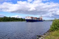 Rendsburg, Germany - August 22 2025: cargo ship pass beneath the Rendsburg High Bridge on the Kiel Canal Royalty Free Stock Photo