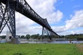 Rendsburg, Germany - August 22 2025: railway High Bridge with camping caravan area on a cloudy day Royalty Free Stock Photo