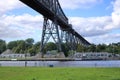 Rendsburg, Germany - August 22 2025: railway High Bridge with camping caravan area on a cloudy day Royalty Free Stock Photo