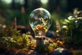 Renewable energy concept, lightbulb powered by solar panel and wind turbine on soil Royalty Free Stock Photo