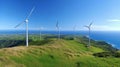 Renewable energy concept: panoramic landscape of the grass field hill with wind turbine generators Royalty Free Stock Photo