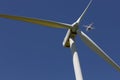 Drone hovering over wind turbines, renewable energy