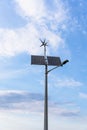 Renewable energy sources. Wind turbine with solar energy power panel, renewable photovoltaic technology. Alternative Royalty Free Stock Photo