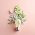 Renewable Energy and Sustainable Living concept depicted by a top view of an Eco-friendly lightbulb made of fresh leaves against a Royalty Free Stock Photo