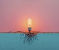 Renewable energy, sustainability conceptual background. Light bulb with growing roots at the base