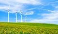 Renewable energy with wind turbines. Wind turbine in green hills. Royalty Free Stock Photo
