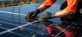 Renewable responsibility Man ensures solar panel efficiency through regular cleaning