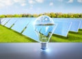 Renewable and sustainable energy development with solar panel in idea light bulb Royalty Free Stock Photo