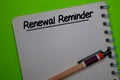 Renewal Reminder write on a book isolated on Office Desk Royalty Free Stock Photo