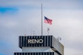 Reno, Nevada city hall roof top with a flag at half-mast. Royalty Free Stock Photo