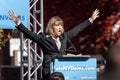 RENO, NV - October 25, 2018 - Kate Marshall with arms open yelling at a political rally on the UNR campus.