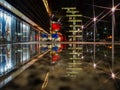 Renoma mall reflected in puddle at night with star lights Royalty Free Stock Photo