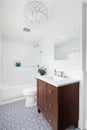 A renovated bathroom with a blue and white mosaic tile floor. Royalty Free Stock Photo