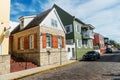 Renovated home with brown shutters on a narrow street in the old town of St. Augustine