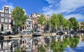 Renovated mansions reflected in a canal, Amsterdam, Netherlands