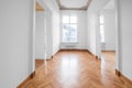 renovated old building room, flat with stucco ceiling and parquet floor