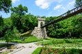 Renovated suspended metallic bridge in Nicolae Romaescu park from Craiova in Dolj county, Romania, in a beautiful sunny spring day