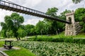 Suspended metallic bridge in Nicolae Romaescu park from Craiova in Dolj county, Romania, in a beautiful sunny spring day