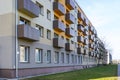 Renovated and thermally insulated facade of a typical 1970s apartment building with balconies