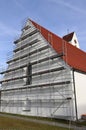 Renovation of a church. A house wall with scaffolding Royalty Free Stock Photo