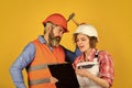 Renovation concept. Couple planning changes renovation apartment. Woman and man wear safety hard hat. Redevelopment of Royalty Free Stock Photo