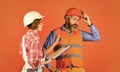 Renovation concept. Price list. Couple look documents. Woman and man safety hard hat. Couple planning changes renovation Royalty Free Stock Photo