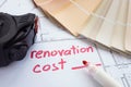 Renovation cost estimate with tape measure and color palette. Royalty Free Stock Photo