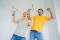 renovation diy paint couple in new home painting wall Royalty Free Stock Photo