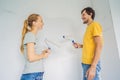 renovation diy paint couple in new home painting wall Royalty Free Stock Photo