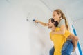 renovation diy paint couple in new home painting wall Royalty Free Stock Photo