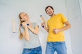 renovation diy paint couple in new home painting wall Royalty Free Stock Photo