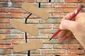 Renovation of an old brick wall - concept image with hand writing and adhesive bandage