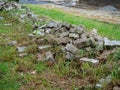 Renovation. Sidewalk renovation. Tiles on the grass. Construction Materials