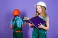 Renovation team. Kids girls planning renovation. Repaint walls. Move in new apartment. Children sisters run renovation Royalty Free Stock Photo