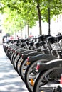 City bikes for rent parked in a row - alternative urban transportation means