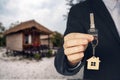 Rent a Bungalow on the beach for a holiday. man buying new house. hand receiving house key. Close up hand holding house key Royalty Free Stock Photo